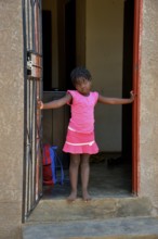 Himba girl in a house in the Himba district of Otuzemba, Otuzemba, Opuwo, Kaokoland, Kunene,