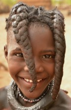 Smiling Himba girl with typical hairstyle, Omuramba, Kaokoland, Kunene, Namibia, Africa