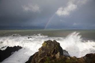 Large Atlantic storm waves crashing onto jagged rocky coast at Hartland Quay, north Devon, England,