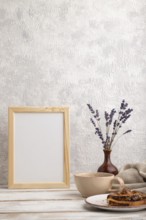 White wooden frame mockup with lavender in ceramic vase, linen textile, cup of coffee and bun on