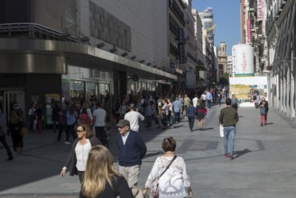 Shoppers in pedestrianised street, Calle Preciadios, Madrid city centre, Spain, Europe