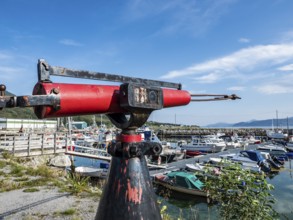 Botnham, harbor at the ferry kai, harpoon as monument, Senja, Troms, Norway, Europe