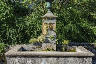 Old historic fountain with curved tap Water spout for permanent drinking water supply Water supply