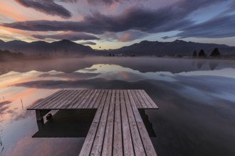 Mountains reflected in lake, footbridge, cloudy mood, morning light, silence, tranquillity,