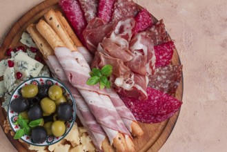 Appetizer, assortment, set, sausage, and cheese, on a wooden board, top view, no people