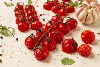 Baked branch, mini, cherry tomatoes, with spices and herbs, garlic, food background, top view, on a