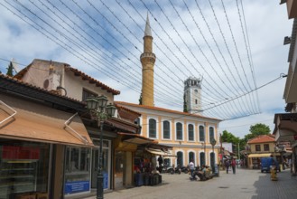 Tourist street with a minaret and shops under a network of fairy lights, New Mosque and Clock