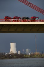 Beeckerwerther Brücke, motorway bridge, A42, truck, cargo ship on the Rhine, behind the STEAG