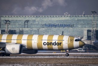 Condor, aircraft, on the taxiway at Frankfurt FRA airport, Fraport, in winter, Hesse, Germany,