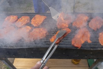 Pork steaks on a charcoal grill, Kirchweih in Franconia, Bavaria, Germany, Europe