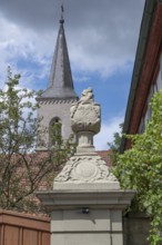 Vase attachment on a courtyard gate, 1774, behind the tower of the parish church of St John the