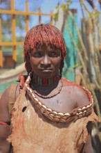 Southern Ethiopia, woman of the Hammer people in Dimeka, dress made of goatskin and hair dyed with