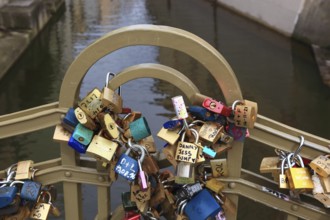 Lover's lock on a railing, love lock is a padlock which, according to custom, is attached to