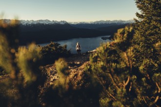 Trail running in autumn on the Jochberg on Lake Walchensee against the wonderful backdrop of the