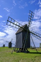 Three traditional historic windmills (Resmo väderkvarnar) in the village of Resmo on Öland, Kalmar