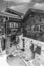 Old wooden houses in the historic centre of Grimentz, black and white photo, Val d'Anniviers,