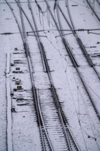 Winter weather, heavy snowfall, railway tracks in front of Essen central station, heated points