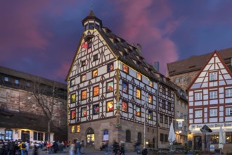 Historic Pilatus House with an Advent calendar in the evening, Tiegärtnertorplatz, Nuremberg,