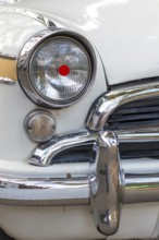 Headlights, front light with red lucky spot, chrome-plated bumper, white Ambassador, vintage car,