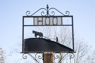 Sign showing horse and ploughman at the rural hamlet of Hoo, Suffolk, England, United Kingdom,