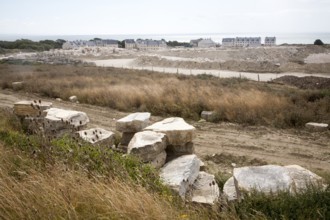 Working quarry and new housing built with local stone, Isle of Portland, Dorset, England, United