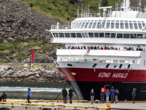 Ship 'Kong Harald' of Hurtigruten company is approaching pier, harbor of Stamsung, on landing,