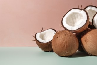 Whole and halved coconuts on studio background. KI generiert, generiert AI generated