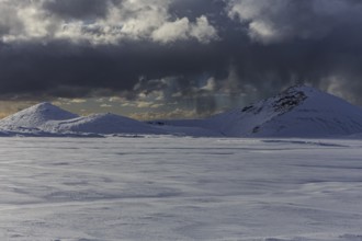 Cloudy mood and snowstorm over an old volcano, snow, winter, Neshraun, Snaefellsnes, Vesturland,