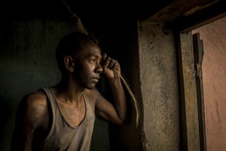 Workers in an aluminium recycling factory in the highlands of Madagascar