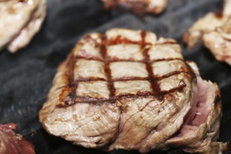 Steak on the grill with diamond pattern