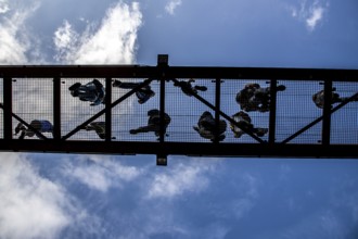 Lattice walkway, people walk over a walkway at a height of a good 15 metres, made of steel lattice,