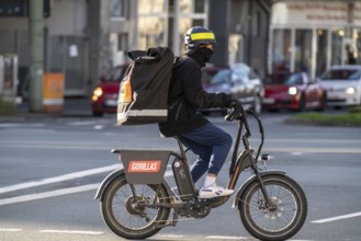 Bicycle courier from the fast delivery service Gorillas, delivers groceries, currently in over 20