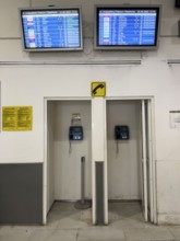 Payphones, cabins, in the departure hall of Heraklion airport on the Greek island of Crete,