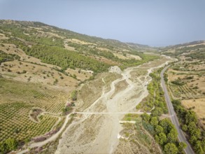 The dry riverbed of the Canale Raia, which is fed by the Torrente del Ferro torrent with water from