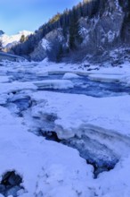 Inn or En near Scuol in winter, with ice floes, Engadin, Grisons, Switzerland, Europe