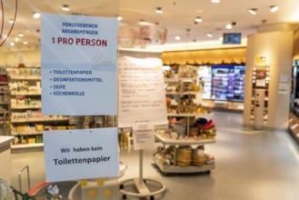 DM drugstore, signs at the entrance, no toilet paper, only one hygiene product per person, effects