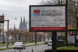 LED billboard, with digital advertising for Corona rapid tests, in the test centre in Cologne, on