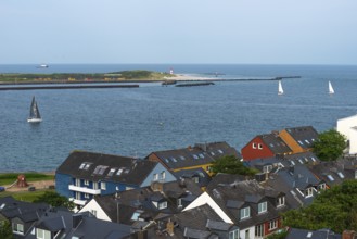 View from the upper land over houses in the lower land to the Helgoland dune, offshore island