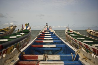 Colourful front of pirogues used by fishermen (Joal, Senegal)