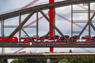 The Beeckerwerther Rhine bridge of the A42 motorway, truck traffic, in front of it the Haus-Knipp