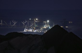 Lignite excavators extract coal in the Welzow open-cast mine, operated by LEAG. The lignite is