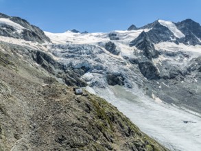 Mountain hut Cabane de Moiry, located close to the retreating Moiry glacier, hiking trail, aerial