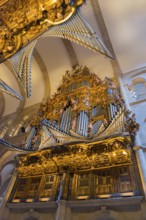 Magnificent baroque organ with detailed carvings and golden decorations, cathedral, Santiago de