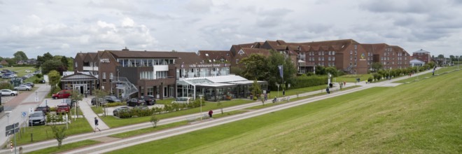 Building on the dyke, view of the village, Norddeich, East Frisia, Lower Saxony, Germany, Europe