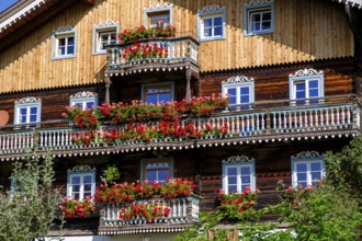 Farmhouse decorated with flowers. Burg district, Kals am Großglockner, East Tyrol, Austria, Europe