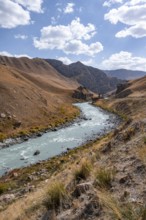 Mountain valley with river between golden meadows, Bolgart Valley, Naryn Province, Kyrgyzstan, Asia