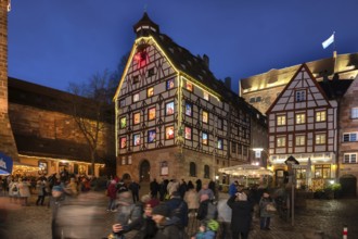 Pilatushaus, built in 1489, a historic town house with an Advent calendar on 18 December 2024 at