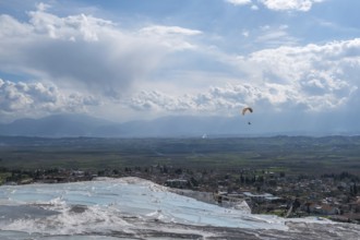 Sintered limestone terraces of Pamukkale, tandem paragliding, Pamukkale, Denizli province, Aegean