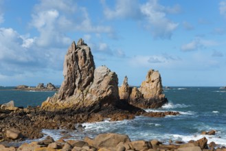 Rough sea on a rocky coast under a cloudy sky, Plage de Pors Scaff, Plougrescant, Côtes-d'Armor,