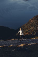 Trail running in autumn on the Jochberg on Lake Walchensee against the wonderful backdrop of the